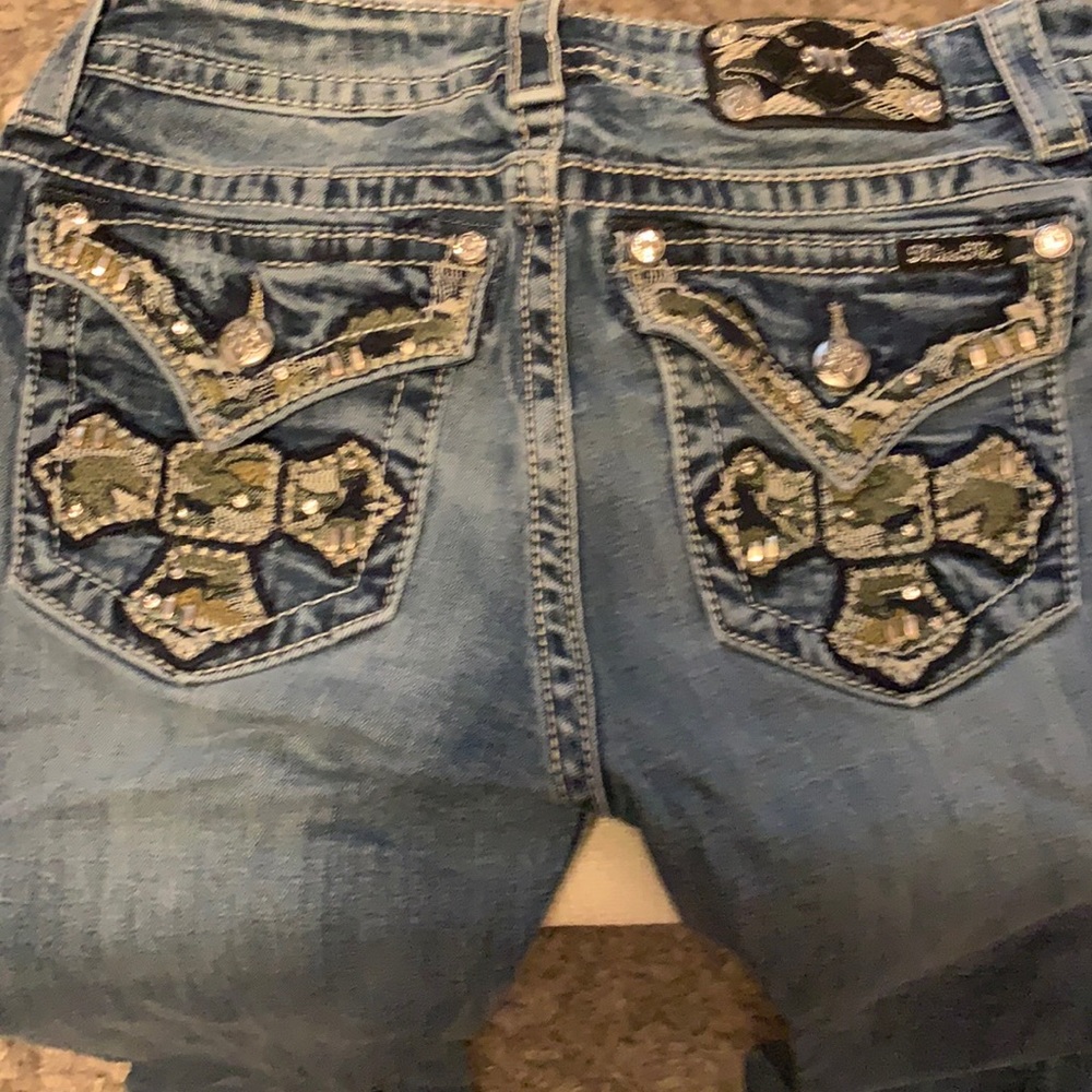COPY - Miss Me Camo Cross pocket studded.